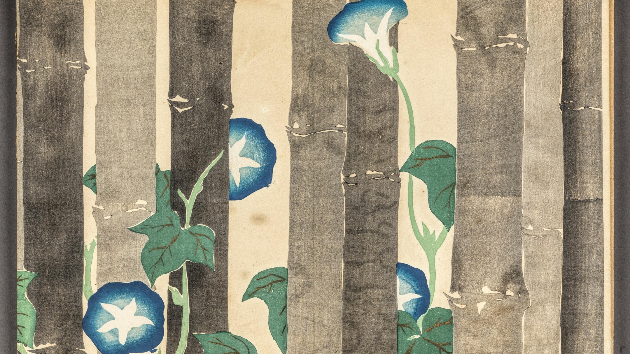 A vertical artwork of brown bamboo stalks with blue and white morning glory flowers and green leaves entwining them.