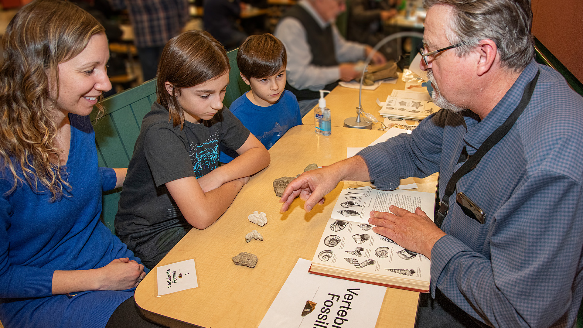 Professor educating students about rocks