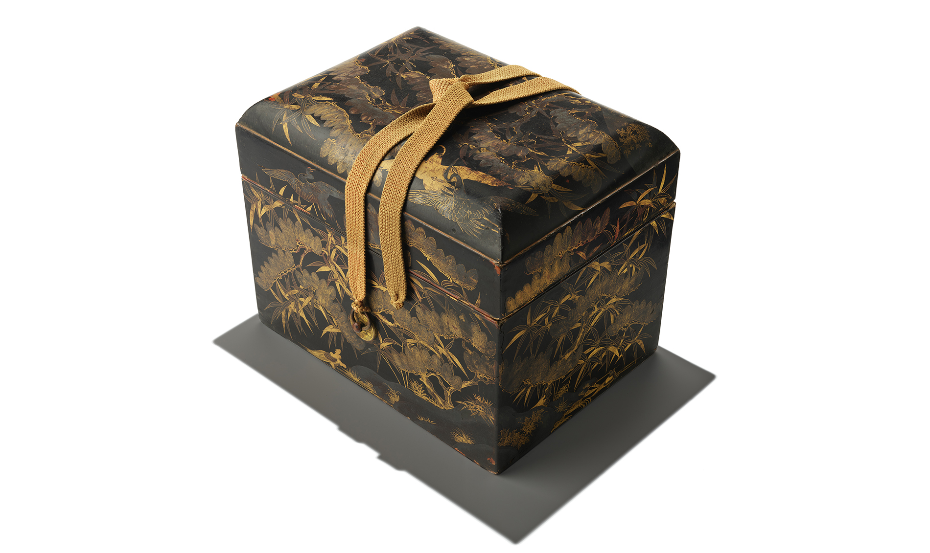 Te-bako (cosmetic box) with pine tree, bamboo, crane, and turtle motifs. Momoyama period 1575-1600 AD. Japan. Lacquered wood with maki-e gilding and brass fittings.