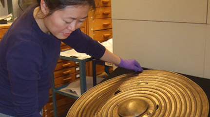 Re-seating a rare Bronze Age shield in collections storage
