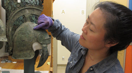 Examining a helmet for the Fact or Falsehood display
