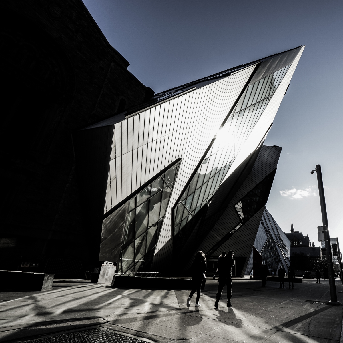 Royal Ontario Museum’s Michael Lee-Chin Crystal building with angular glass and metal panels, under a clear sky.