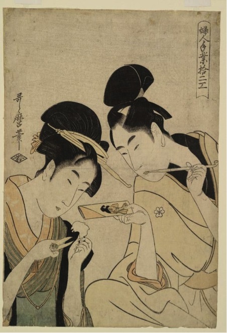 Two women with traditional hairstyles eating noodles, one holding a bowl and the other using chopsticks.