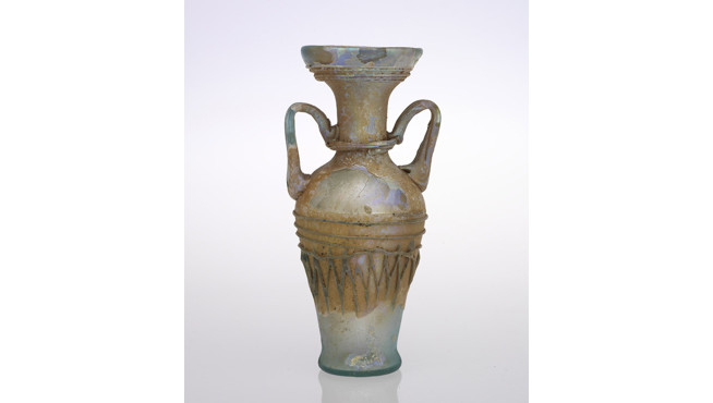 Tall ancient ceramic vase with two handles, decorated with geometric patterns and a narrow neck.