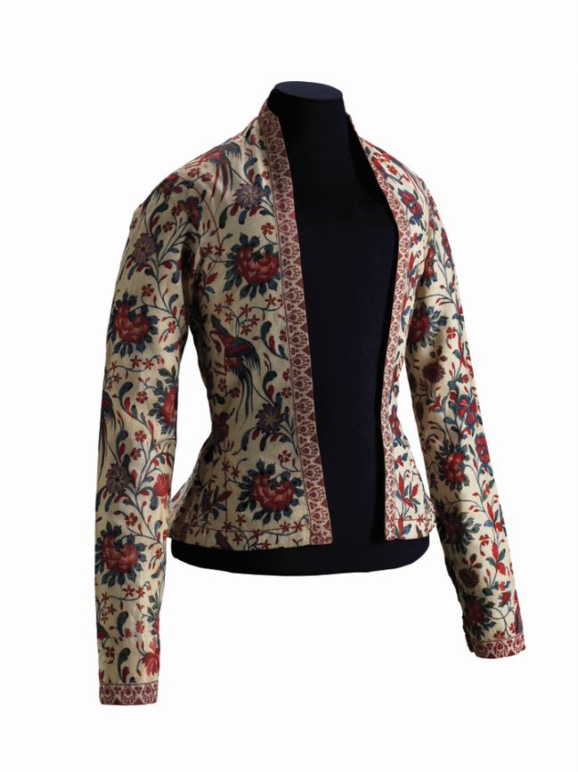 Jacket with long sleeves featuring an intricate floral pattern with red, blue, and beige colors.
