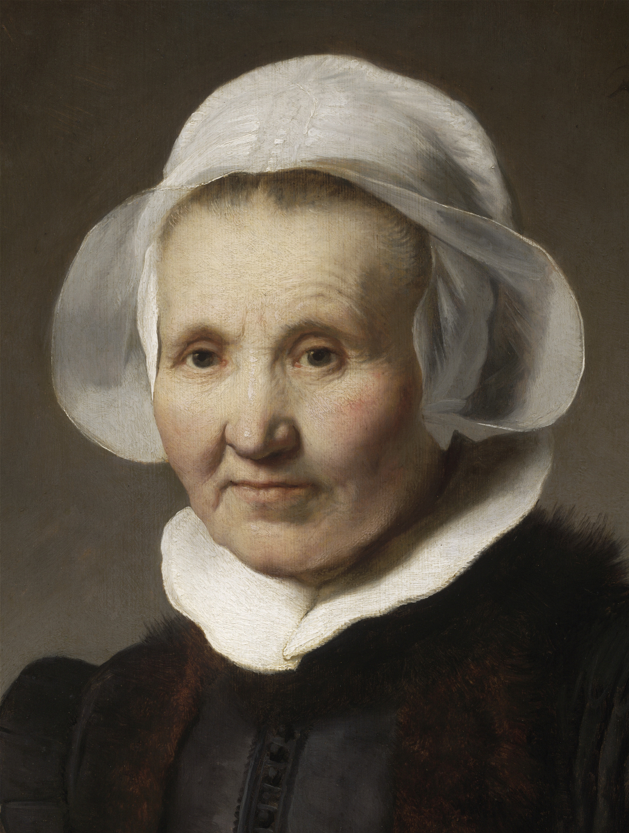 Portrait of an elderly woman wearing a white bonnet and dark clothing with a white collar.