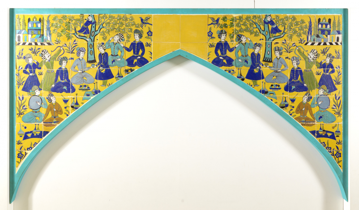 Decorative arch with yellow and blue tile artwork featuring geometric and floral patterns.