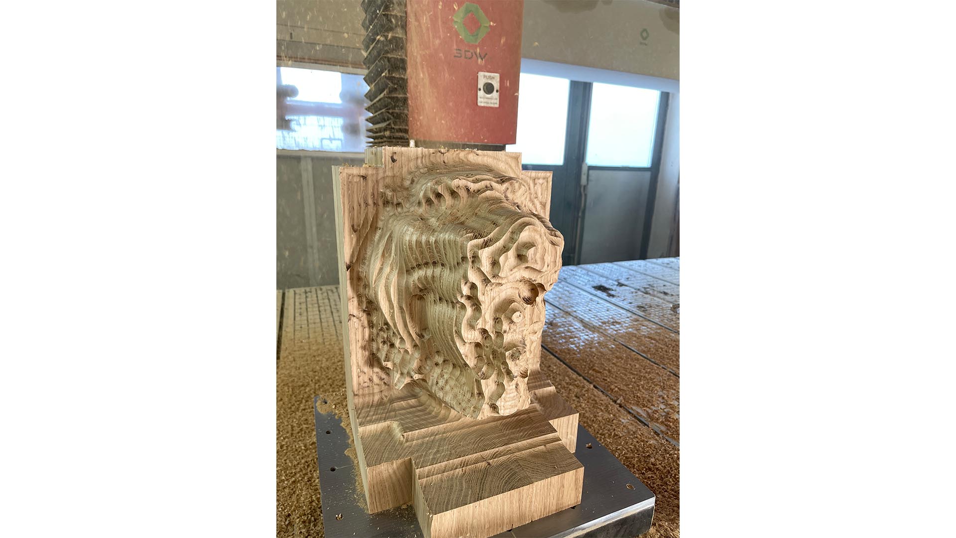 Sculpture being carved by an axis CNC carving maxhine.