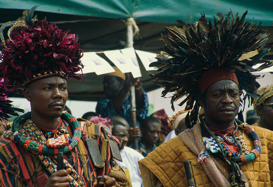 Warriors wearing ceremonial feather headdresses.