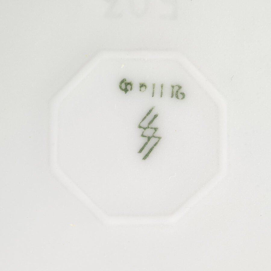 Stamp on the bottom of the vase, Slave Labour and Genocide