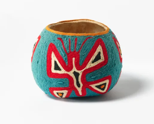 A decorated gourd made by a Huichol artist