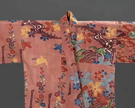 Silk Chinese robe with embroidered floral and bird motifs on a pink background.