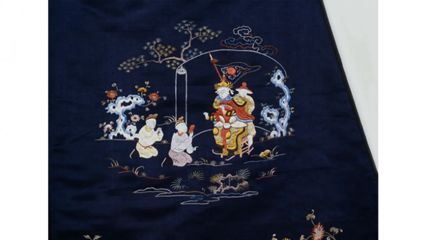 Lady's unofficial robe with floral motifs and figures. China. Qing Dynasty. early 19th century. Satin embroidered in silk. 910.65.21. 