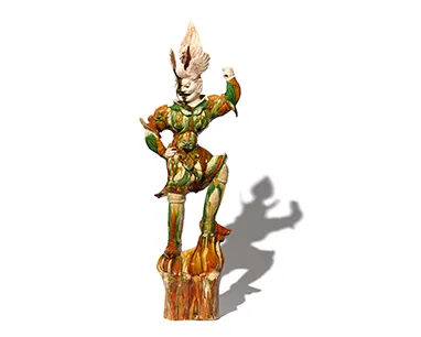 A statue of a man dressed in a costume, holding a sword, stands prominently in a public space.
