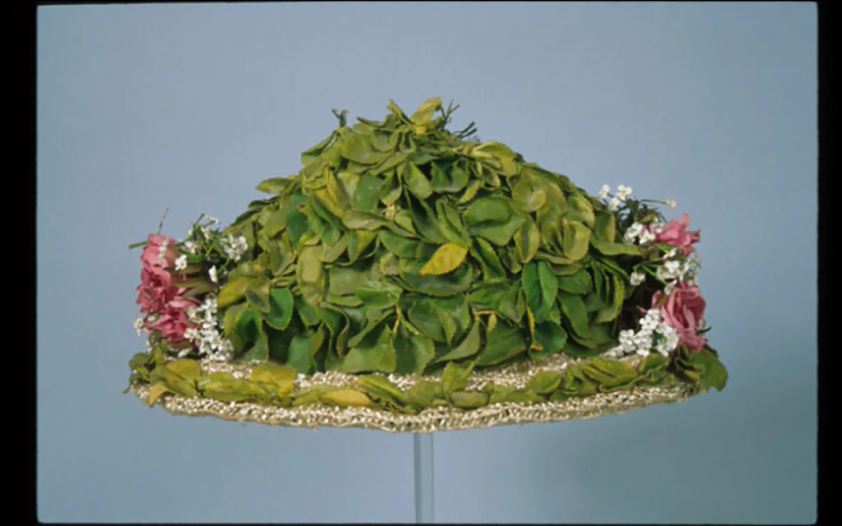 Woman's hat. Used in Canada. Straw with imitation leaves and flowers. c. 1910. 963.9.20. Gift of Miss Adelaide Lash Miller.