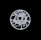 Circular jade disc carved with an abstract dragon and cloud motifs on a black background.